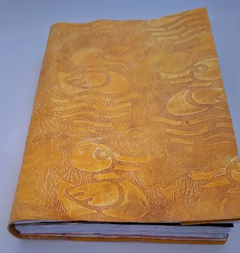 Handgebonden boek om kindertekeningen in te bewaren